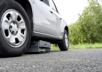 Shark Spike vehicle stopping system concealed under car for surprise scenario