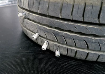Tire punctured by Shark Spike system during vehicle stop demonstration