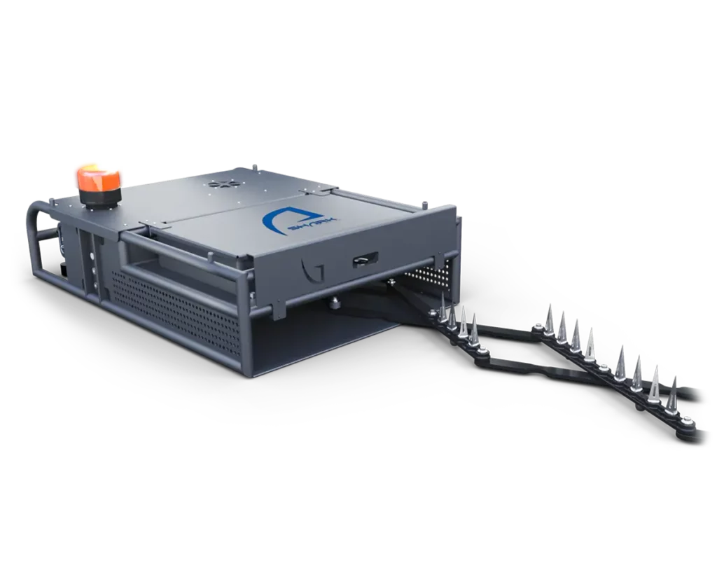 Shark Spike deployed configuration with extended spike strip for vehicle interdiction.